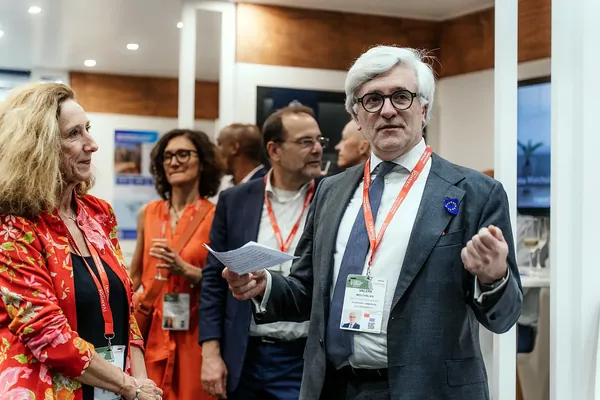 Delegates in conversation on the European Union stand