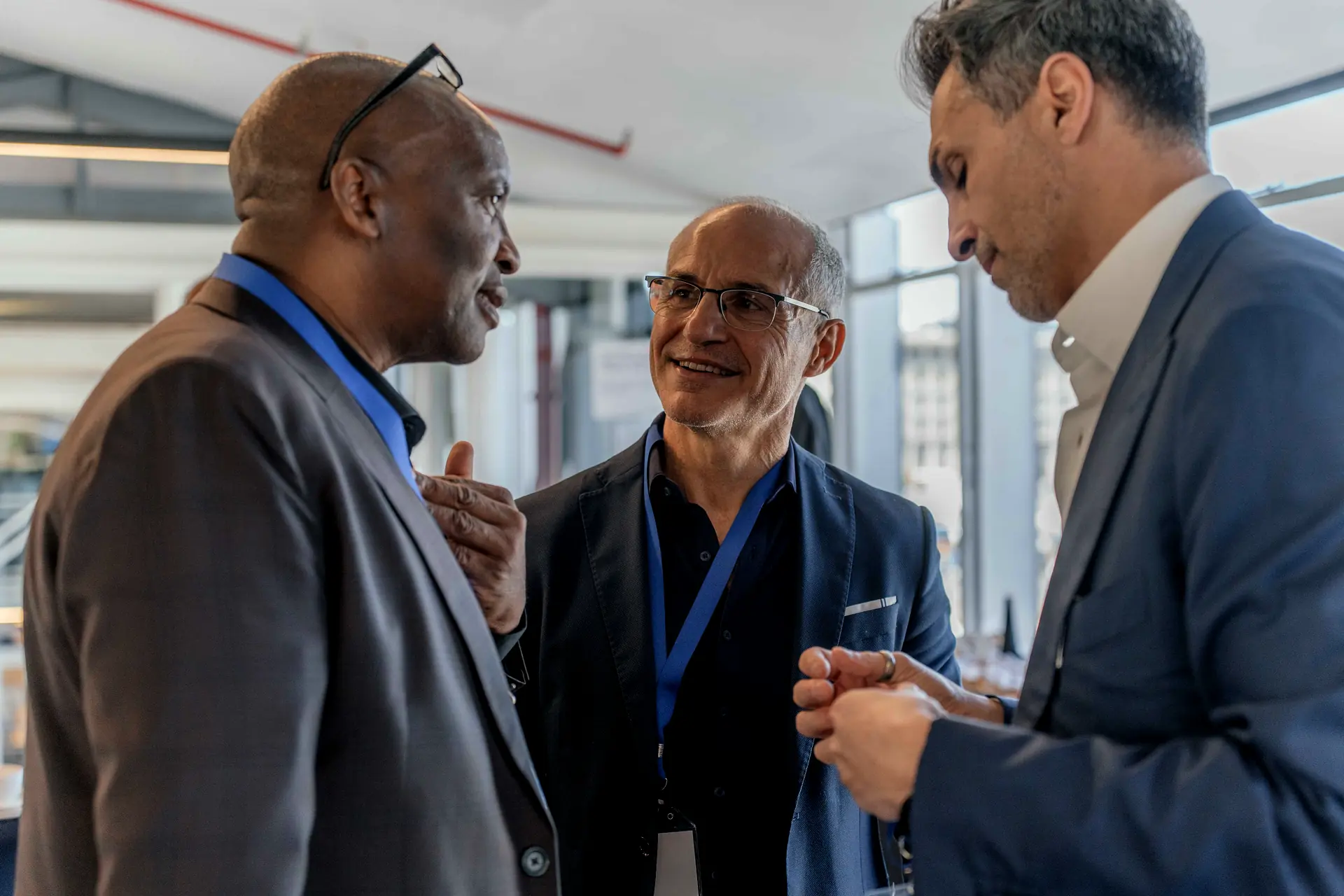 Delegates in conversation at a conference