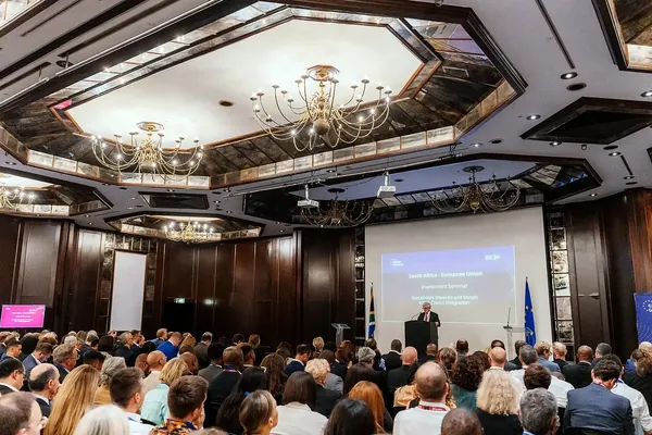 A full hotel ballroom listening to a keynote at the South Africa - European Union investment seminar