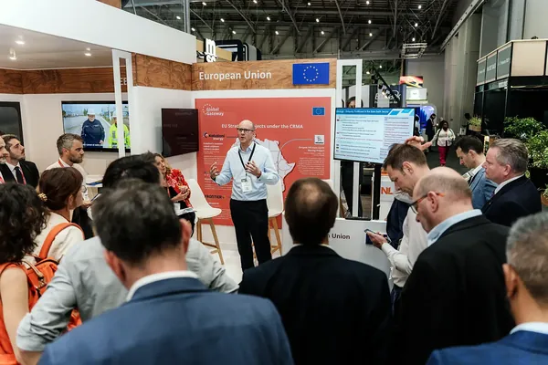 A speaker presenting to delegates at the European Union stand