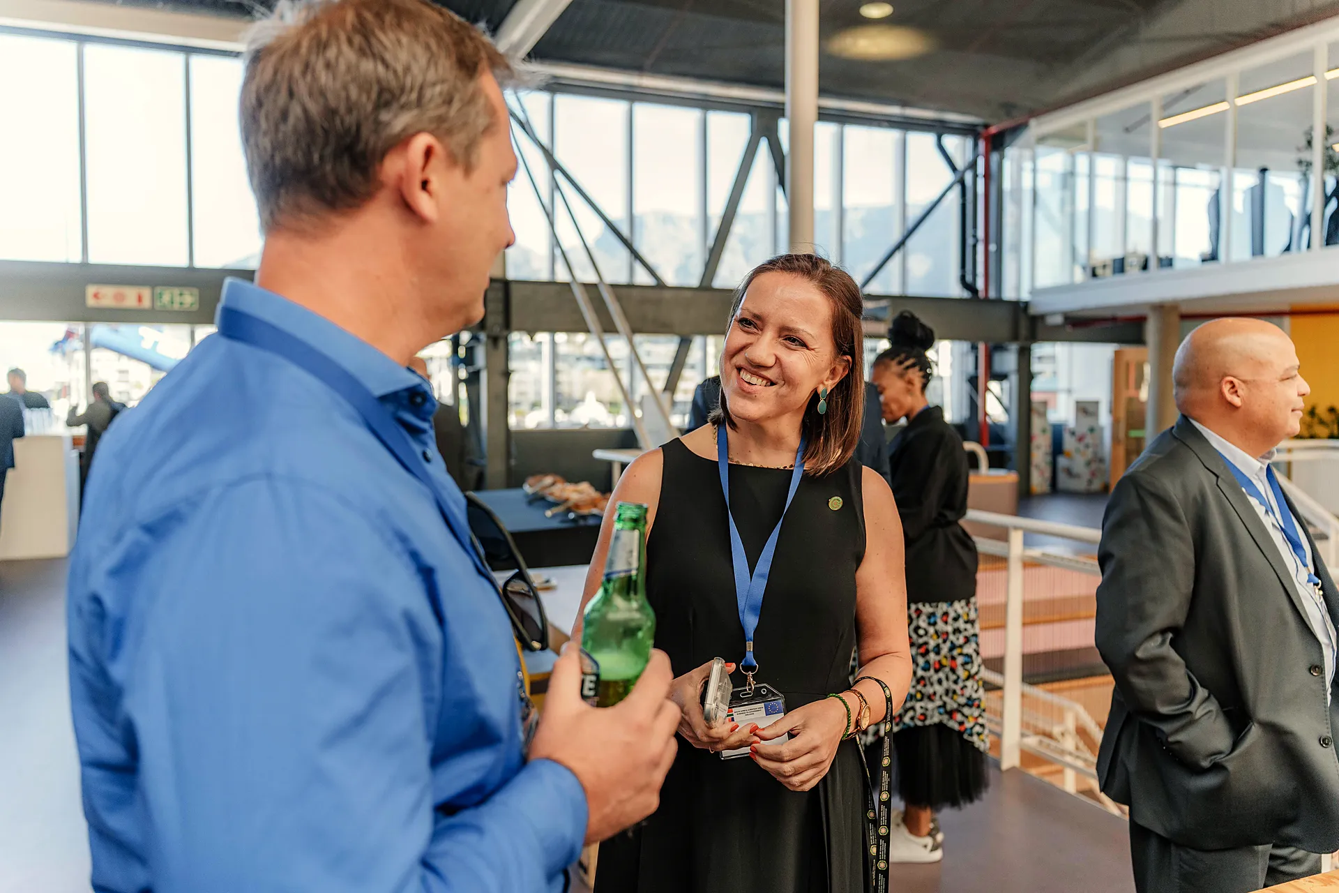 Guests chat over drinks at a conference reception