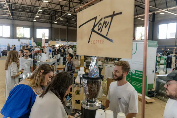 The Kort Coffee stand under its wooden sign, busy with festival-goers