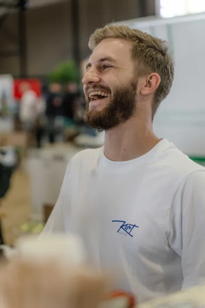 The barista laughing behind the counter